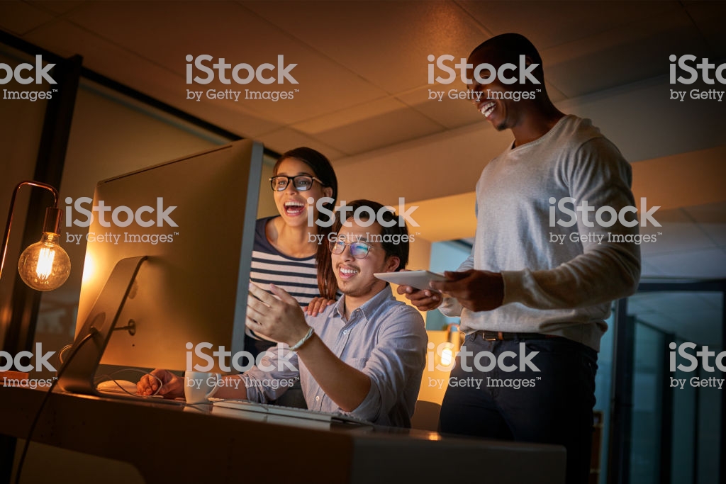 Shot of computer programmers working together late in the office