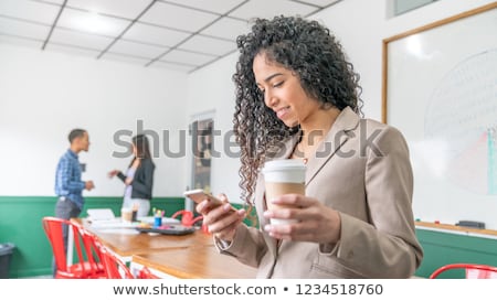 young-business-woman-holding-coffee-450w-1234518760